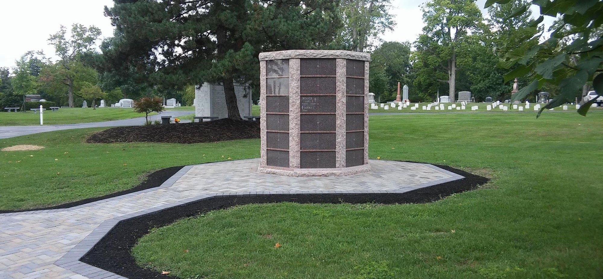 144-niche Dakota mahogany granite with maple granite doors community columbarium at the Woodlawn cemetery. 